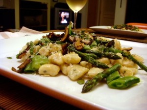 Herb roasted garlic gnocchi with spring vegetables and mushroom fricasee